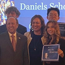 Mayor John Suthers on the left poses with Daniels Scholarship Recipients